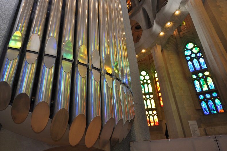 stained glass reflecting in the pipe organ